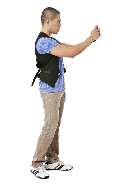 Guy standing while taking picture using phone — Stock Photo, Image