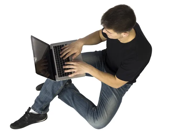 Man met behulp van zijn laptop — Stockfoto