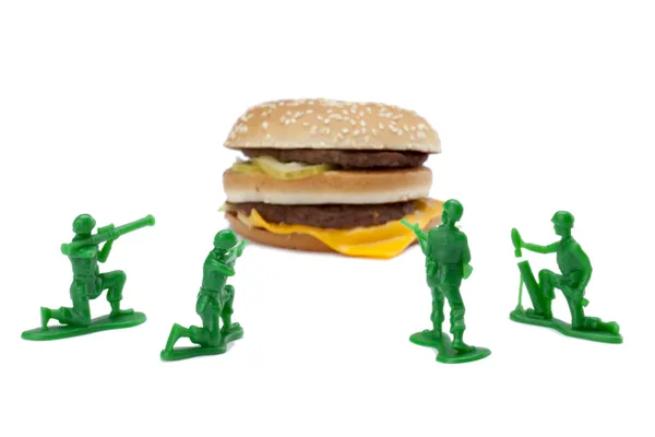 Hamburger with military toy soldiers — Stock Photo, Image