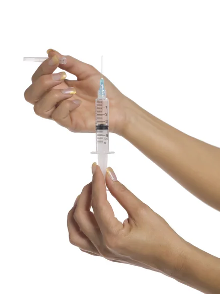 Hand holding medical syringe — Stock Photo, Image