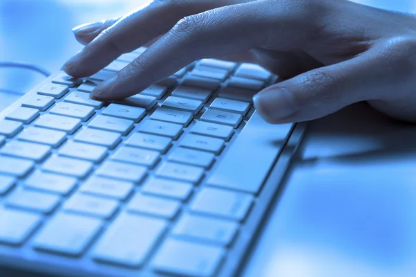 Hands typing on computer keyboard — Stock Photo, Image