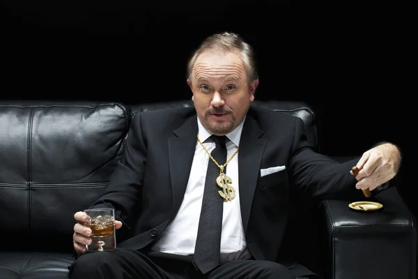 Handsome mafia boss drinking and smoking — Stock Photo, Image