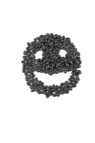 Счастливое лицо из черной фасоли — стоковое фото
