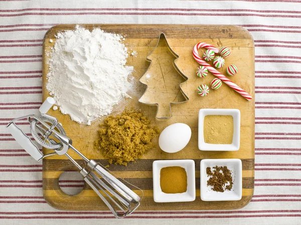 Overhead view of cake ingredient with cookie cutter candy cane a — Stock Photo, Image
