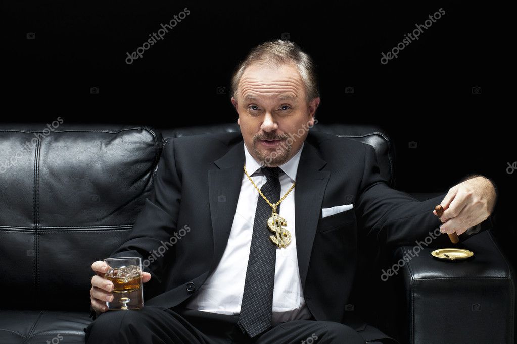 Handsome mafia boss drinking and smoking — Stock Photo © kozzi2 #14094710
