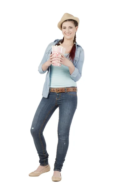 Attractive teenager holding box of popcorn — Stock Photo, Image
