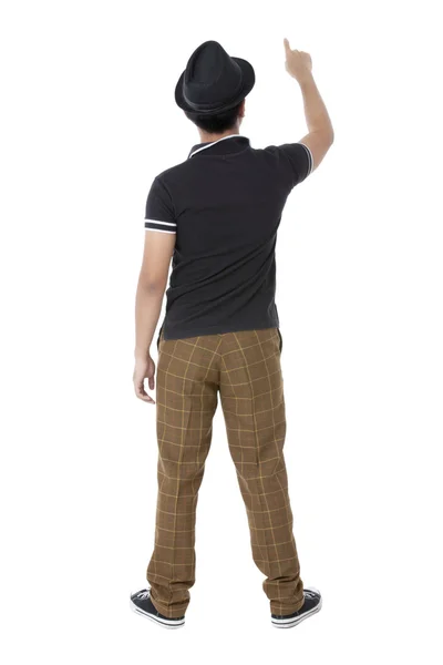 Back of young man pointing on a white background — Stock Photo, Image