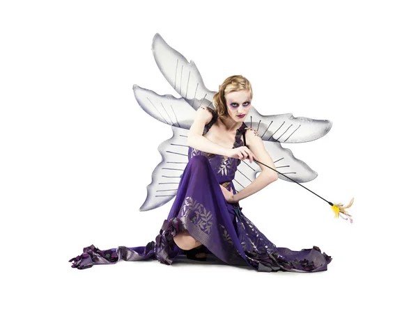 Beautiful woman in fairy dress holding magic wand — Stock Photo, Image