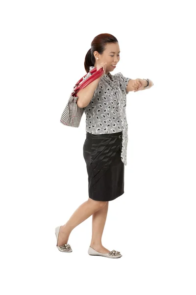 Female with carry bag checking the time — Stock Photo, Image