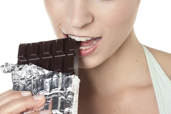 Beautiful lady eating chocolates Stock Photo