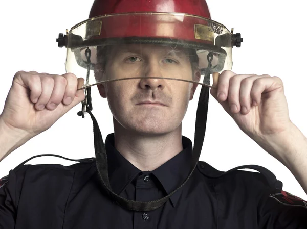 Pompiere con il casco in mano — Foto Stock