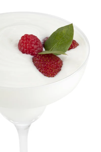 Glass of white cream with raspberries — Stock Photo, Image