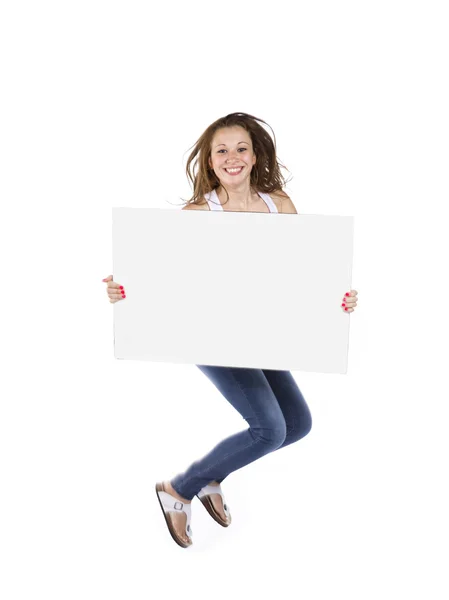 Mutlu genç kız bir afiş tutarak atlama — Stok fotoğraf