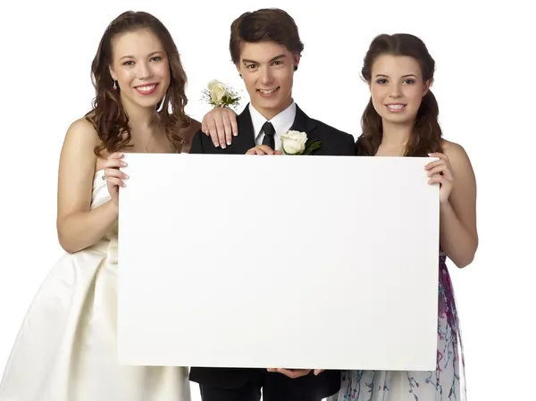 Happy teenager holding white board on prom — Stock Photo, Image