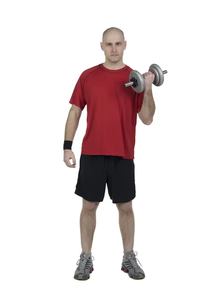 Athletic male using dumbbells — Zdjęcie stockowe