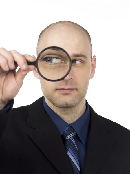 Man holding magnifying glass — Stock Photo, Image