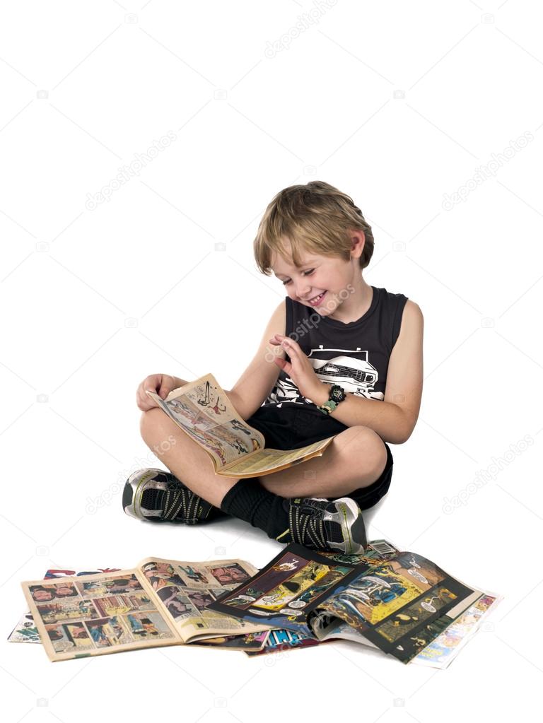 happy boy reading comic book