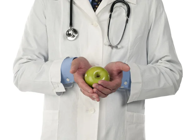 Mid section of a doctor with apple — Stock Photo, Image