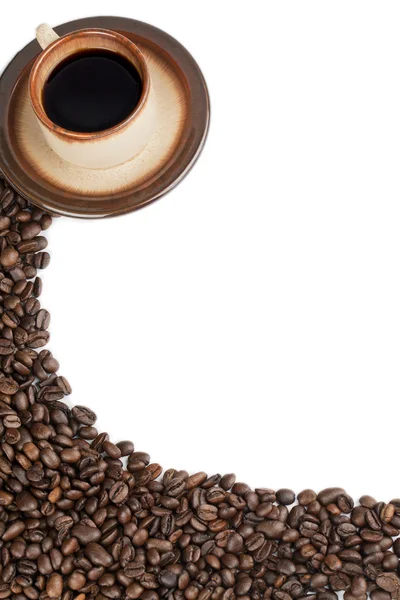 Mug of coffee and coffee beans — Stock Photo, Image