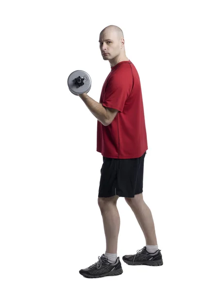 Muscular man lifting dumbbell — Stock Photo, Image