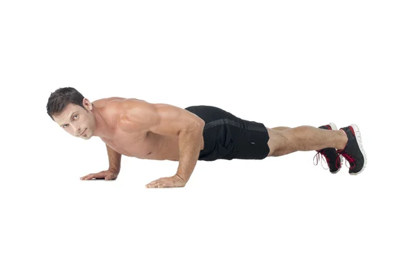 Muscular man on push up — Stock Photo, Image