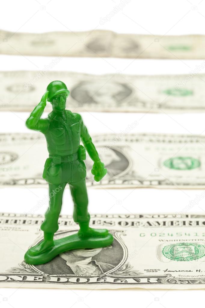 One dollar bill and military toy