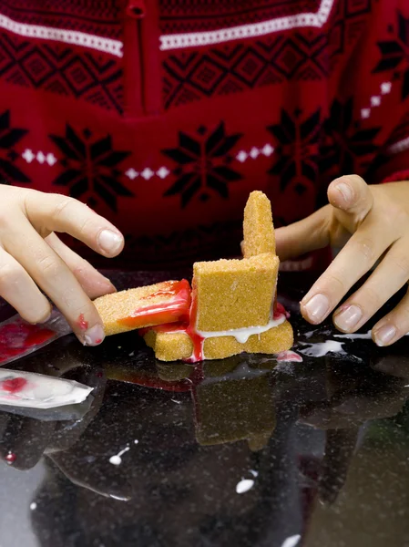 Detailed view of a boy building gingerbread house — Stock Photo, Image