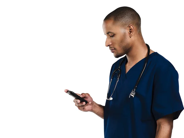 Doctor looking at phone — Stock Photo, Image