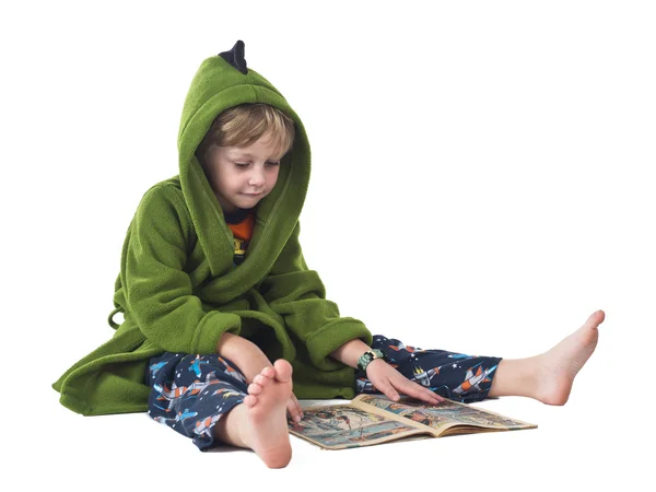 Elementary kid reading comic book — Stock Photo, Image