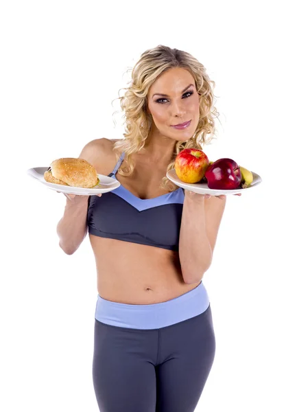 Fitness model with food items — Stock Photo, Image