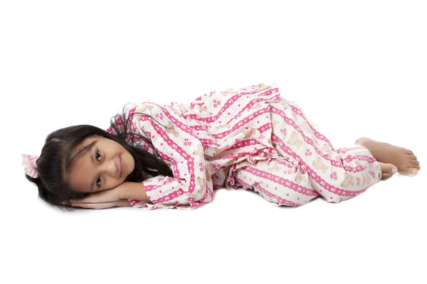 Girl getting lying on white floor — Stock Photo, Image