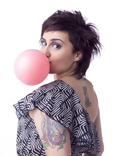 Female blowing a bubble — Stock Photo, Image