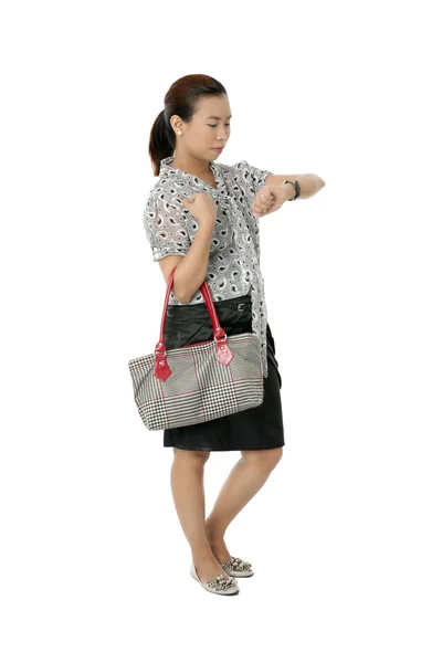 Female with hand bag checking time — Stock Photo, Image