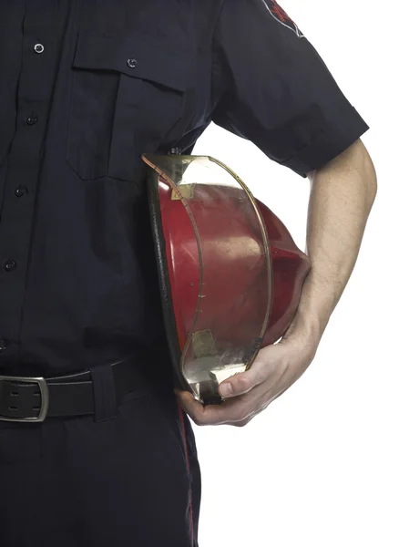 นักดับเพลิงถือหมวกแดง — ภาพถ่ายสต็อก