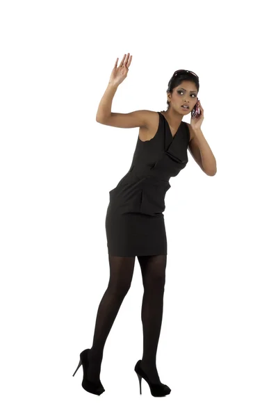 Gesturing woman with cellphone — Stockfoto