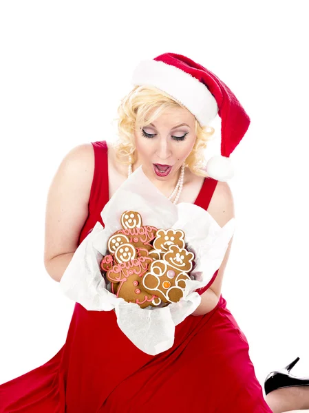 Ecstatic young woman looking at christmas cookies Royalty Free Stock Photos