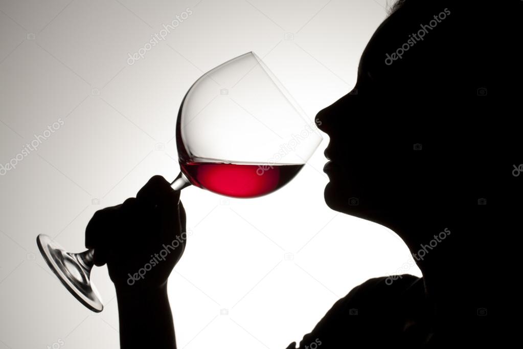 female drinking red wine