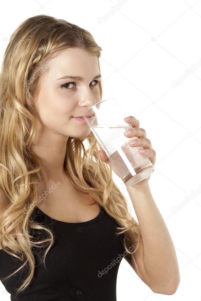 girl drinking water while looking at the camera