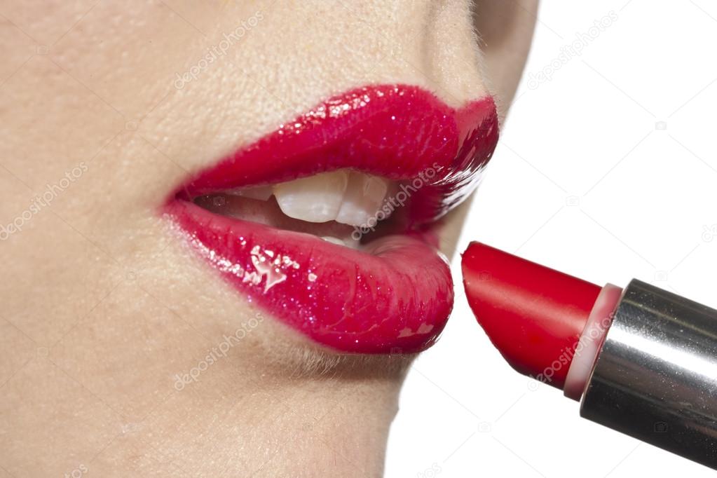 glossy red lipstick stock