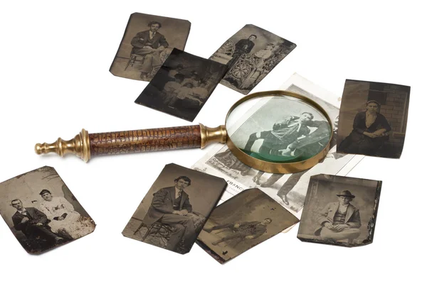 Magnifying glass on photos — Stock Photo, Image