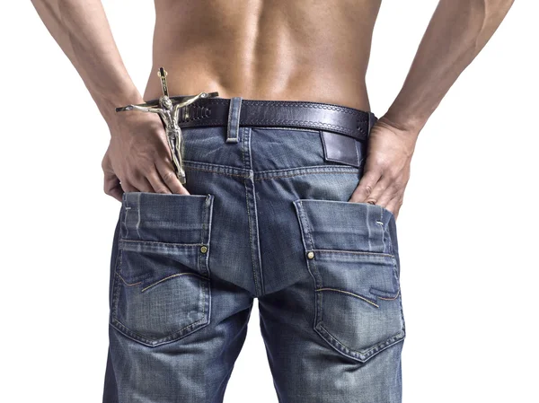 Manos masculinas en su bolsillo trasero con crucifijo —  Fotos de Stock