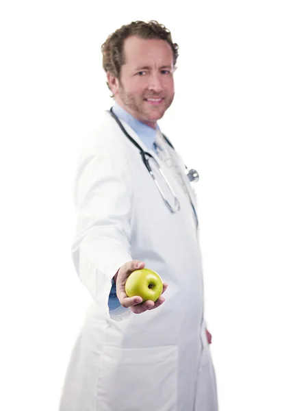 Portrait of a doctor holding green apple — Stock Photo, Image