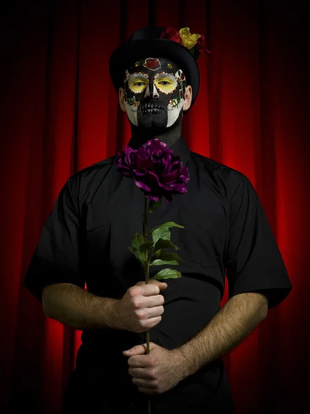 Portrait shot of a man in sugar skull make up over dark backgrou — Stock Photo, Image