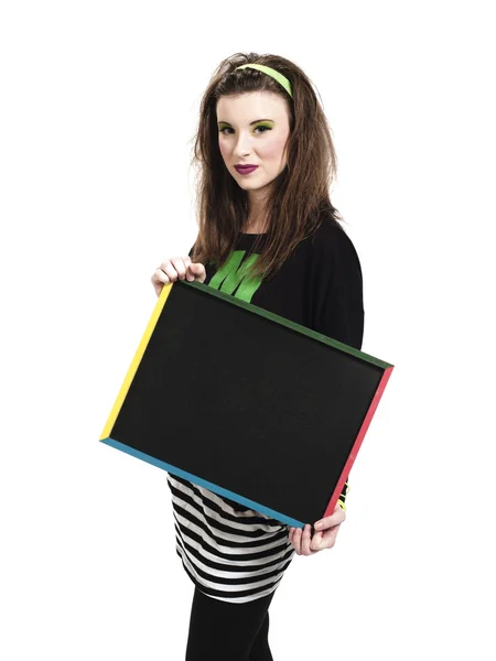 Portrait of a young female holding a blank slateboard — Stock Photo, Image