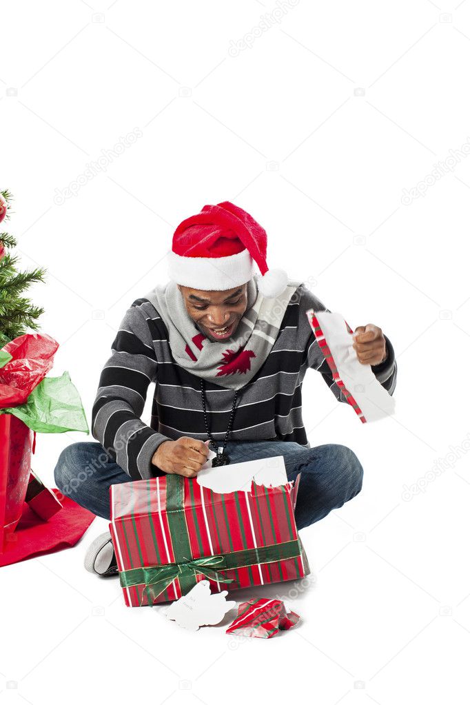 man unwrapping gift
