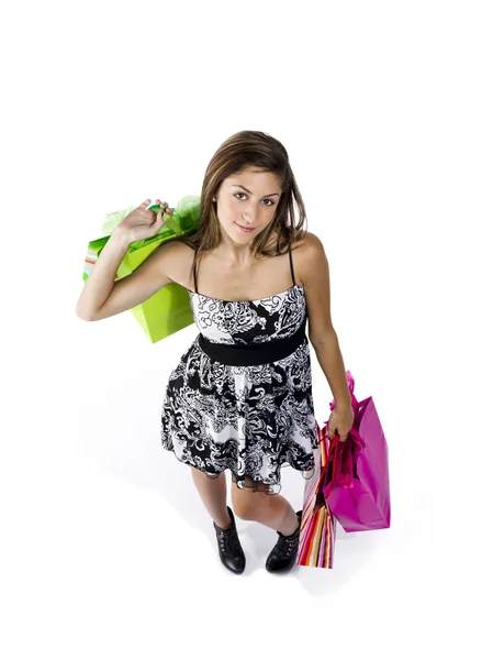 Visão de alto ângulo de uma adolescente segurando sacos de compras — Fotografia de Stock