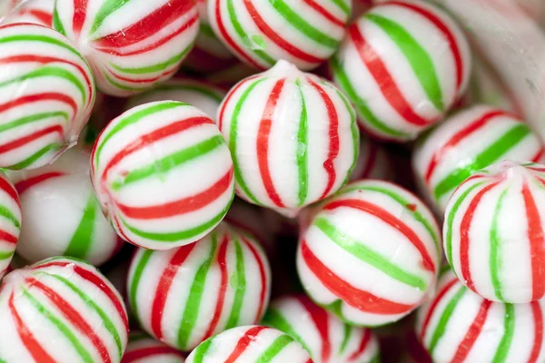 A bunch of colorful candies with red and green stripes — Stock Photo, Image