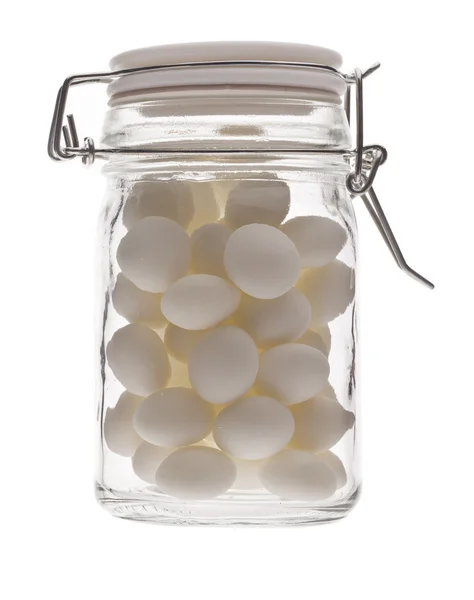 A jar with white candies — Stock Photo, Image