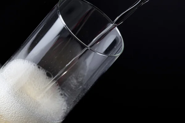 Alcoholic drink poured in a glass — Stock Photo, Image