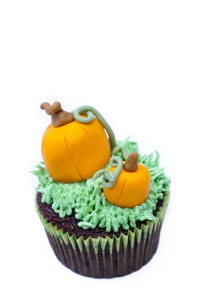 Close up image of cupcake with pumpkin miniature — Stock Photo, Image